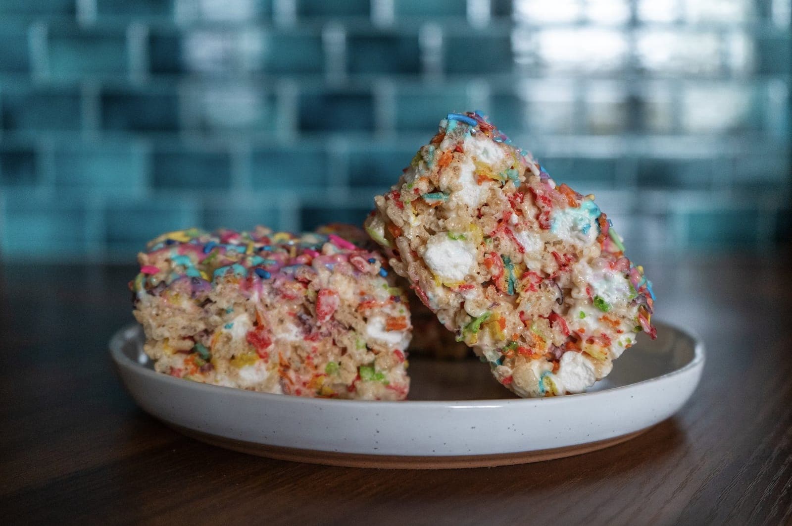 Colorful Unicorn Crispies with rainbow cereal on a board